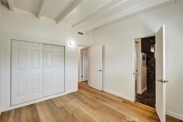 a bathroom with a sink a toilet and a window