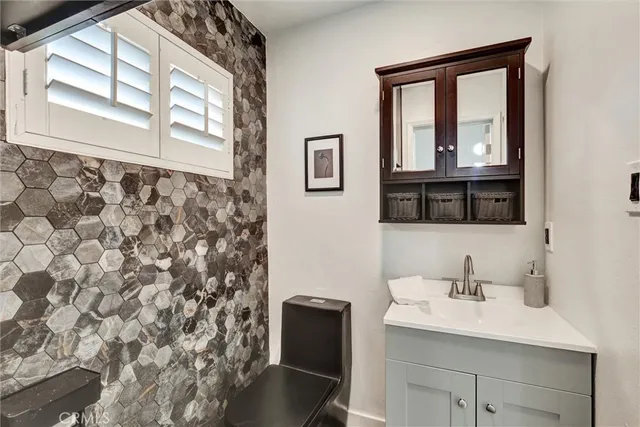 a view of a white house with a outdoor space