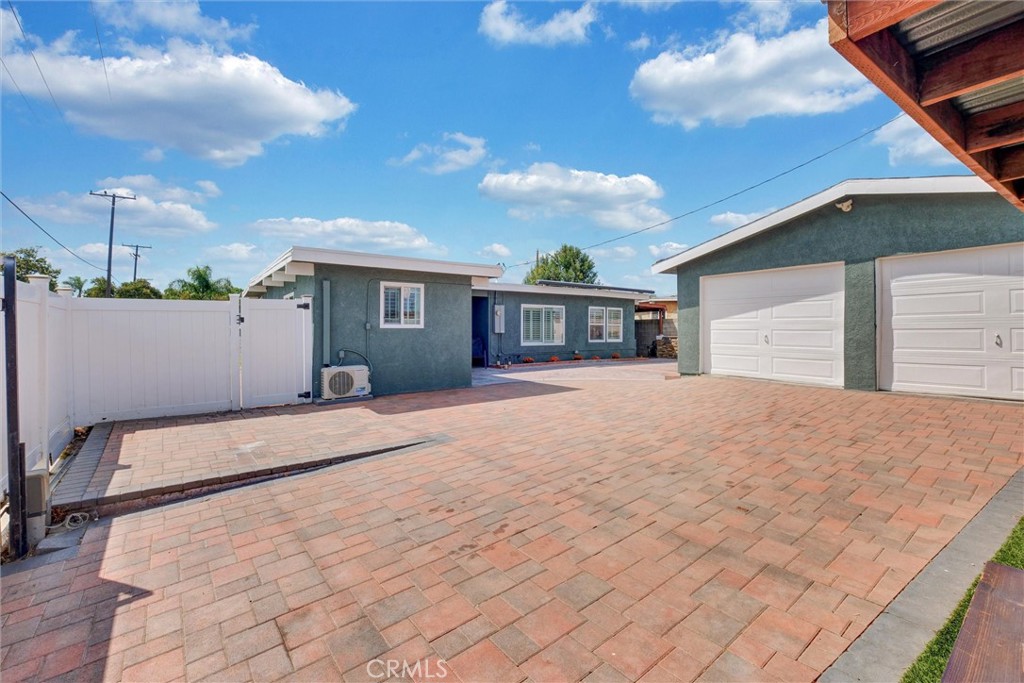 1401 West 165th Street Compton, CA 90220 - Photo 25 of 31 a view of a white house with a outdoor space
