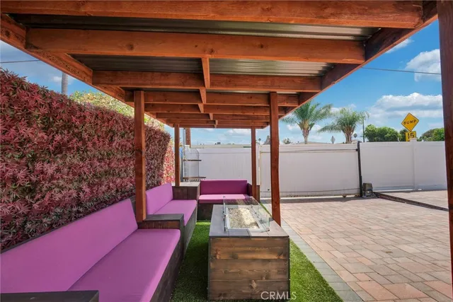 a front view of a house with a yard and seating space