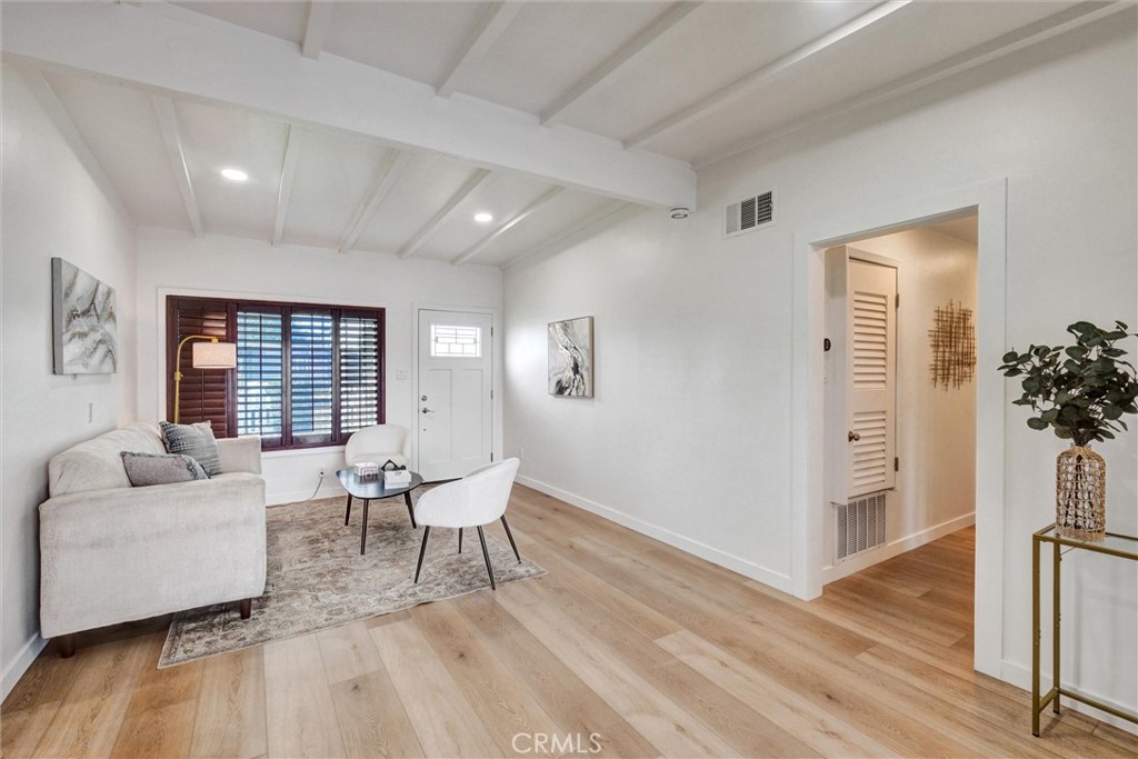 1401 West 165th Street Compton, CA 90220 - Photo 3 of 31 a living room with furniture and wooden floor