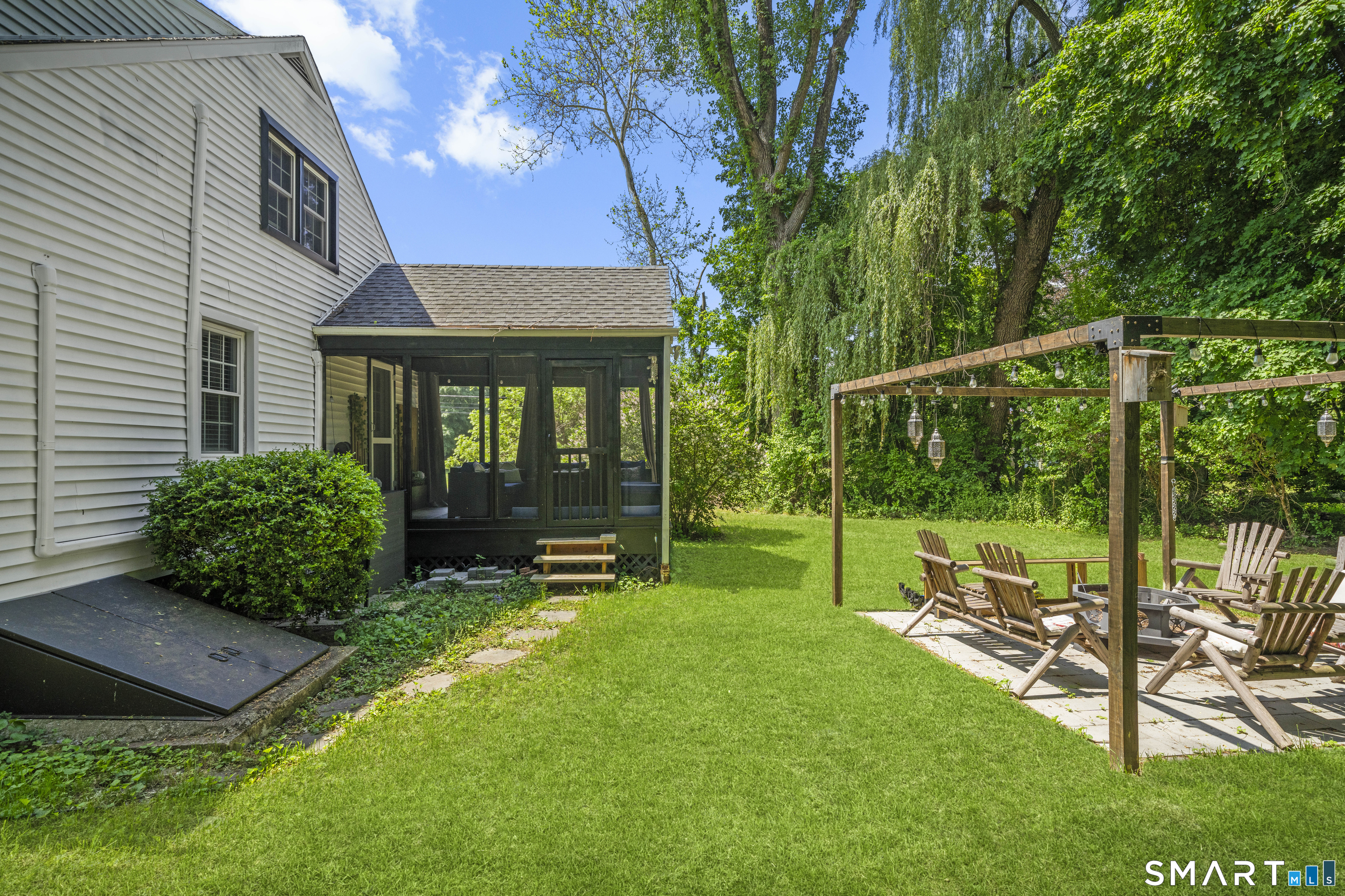 211 Whisconier Road Brookfield, CT 06804 - Photo 37 of 38 a view of a chair and table in backyard of the house