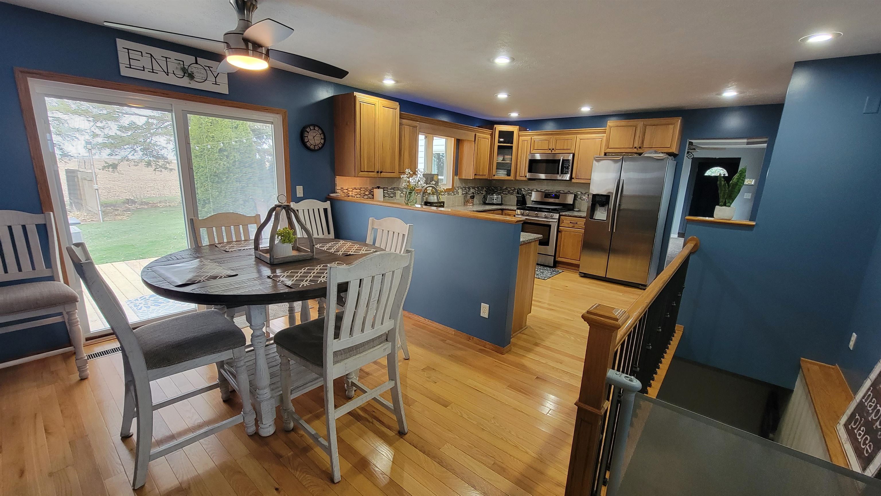 6058 North Irish Grove Road Davis, IL 61019 - Photo 21 of 42 a kitchen with a dining table chairs and refrigerator