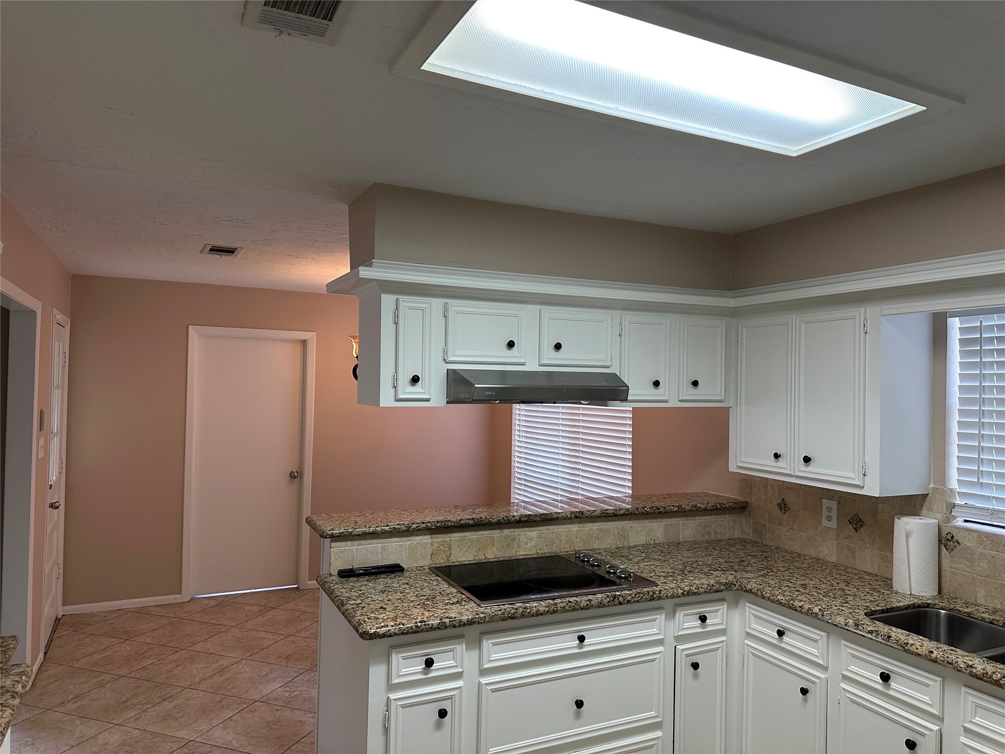 17406 Spicewood Springs Lane Spring, TX 77379 - Photo 11 of 50 a kitchen with granite countertop a sink and a stove