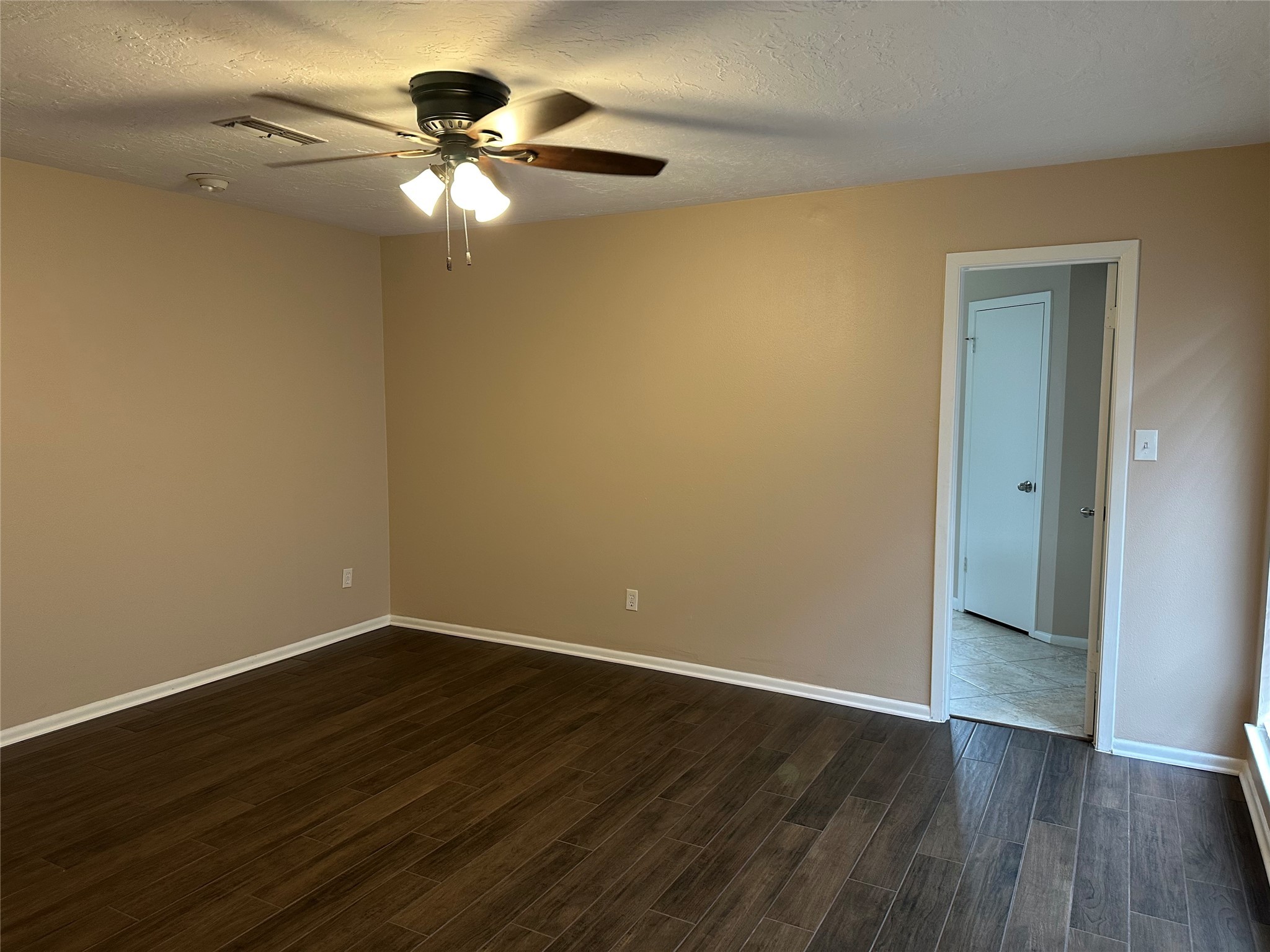 17406 Spicewood Springs Lane Spring, TX 77379 - Photo 19 of 50 a view of an empty room with wooden floor