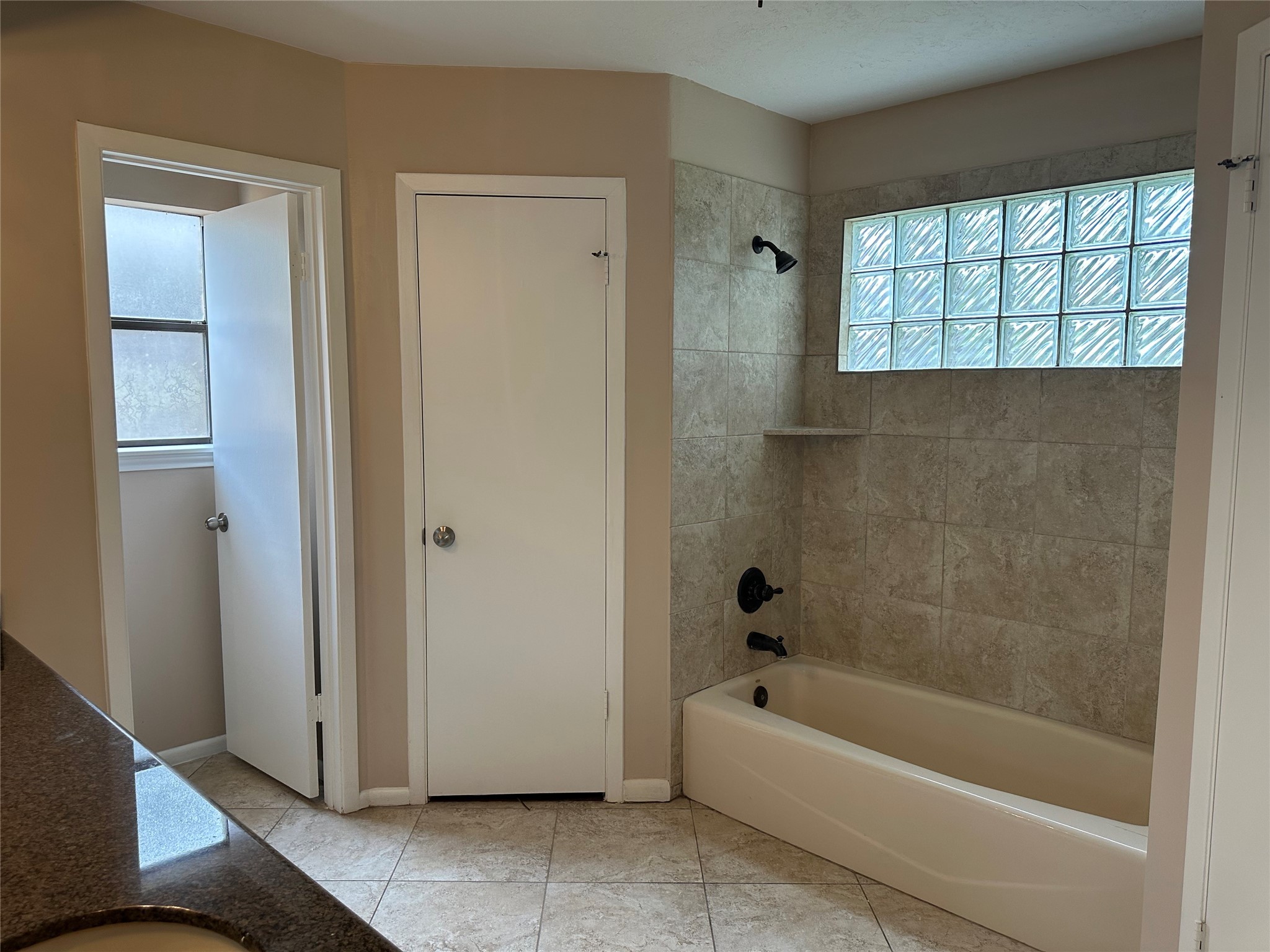 17406 Spicewood Springs Lane Spring, TX 77379 - Photo 22 of 50 a bathroom with a bathtub and a shower