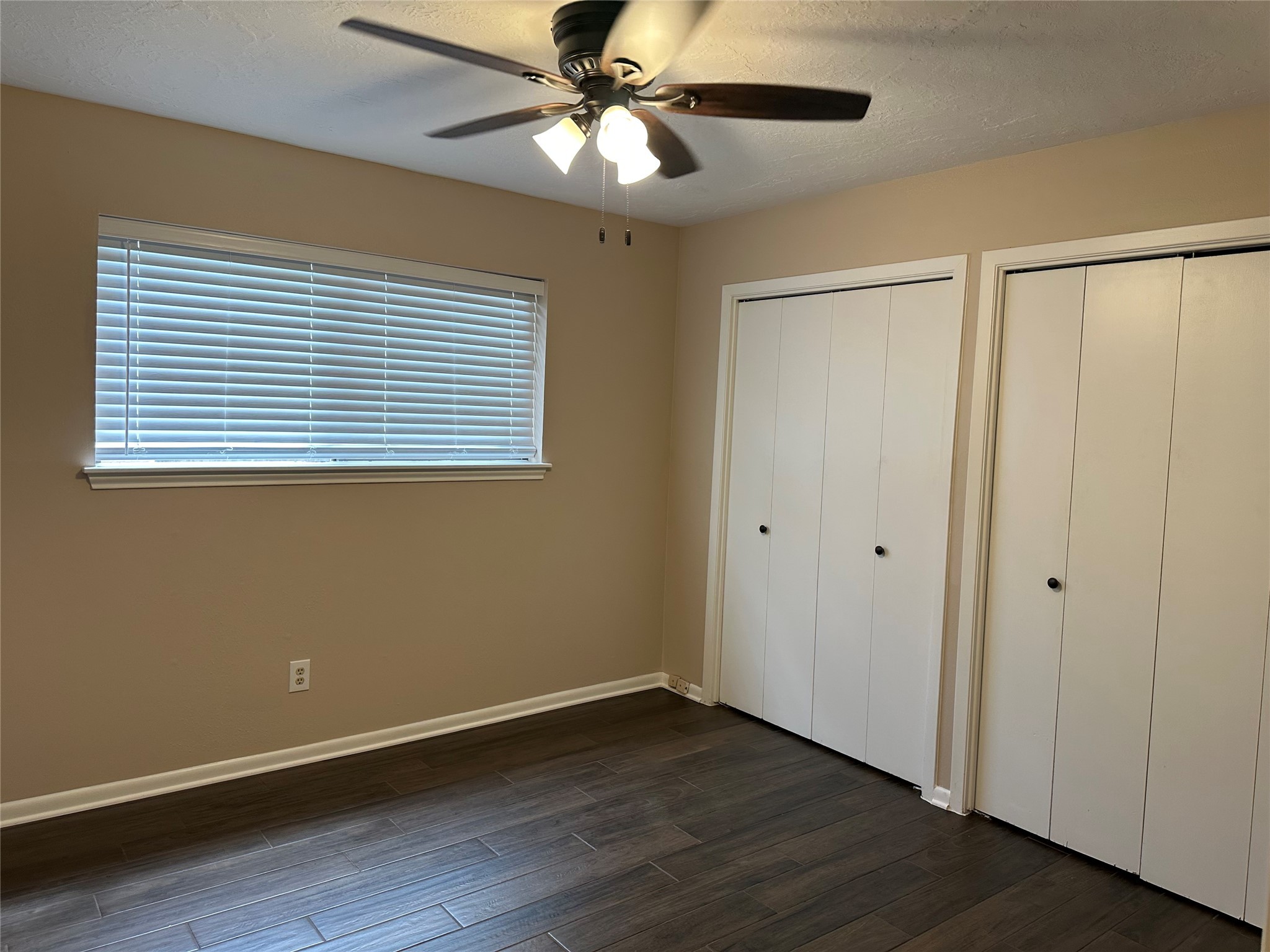 17406 Spicewood Springs Lane Spring, TX 77379 - Photo 24 of 50 a view of an empty room with wooden floor and a window