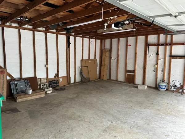 a view of an empty room with windows