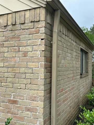a view of an house with backyard space and garden