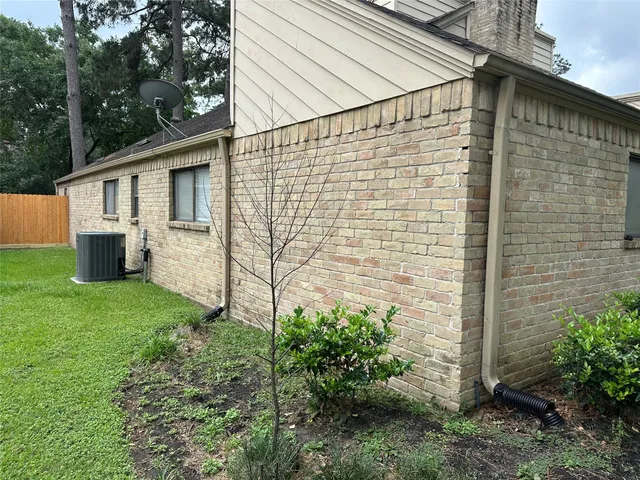 a view of a backyard with tree