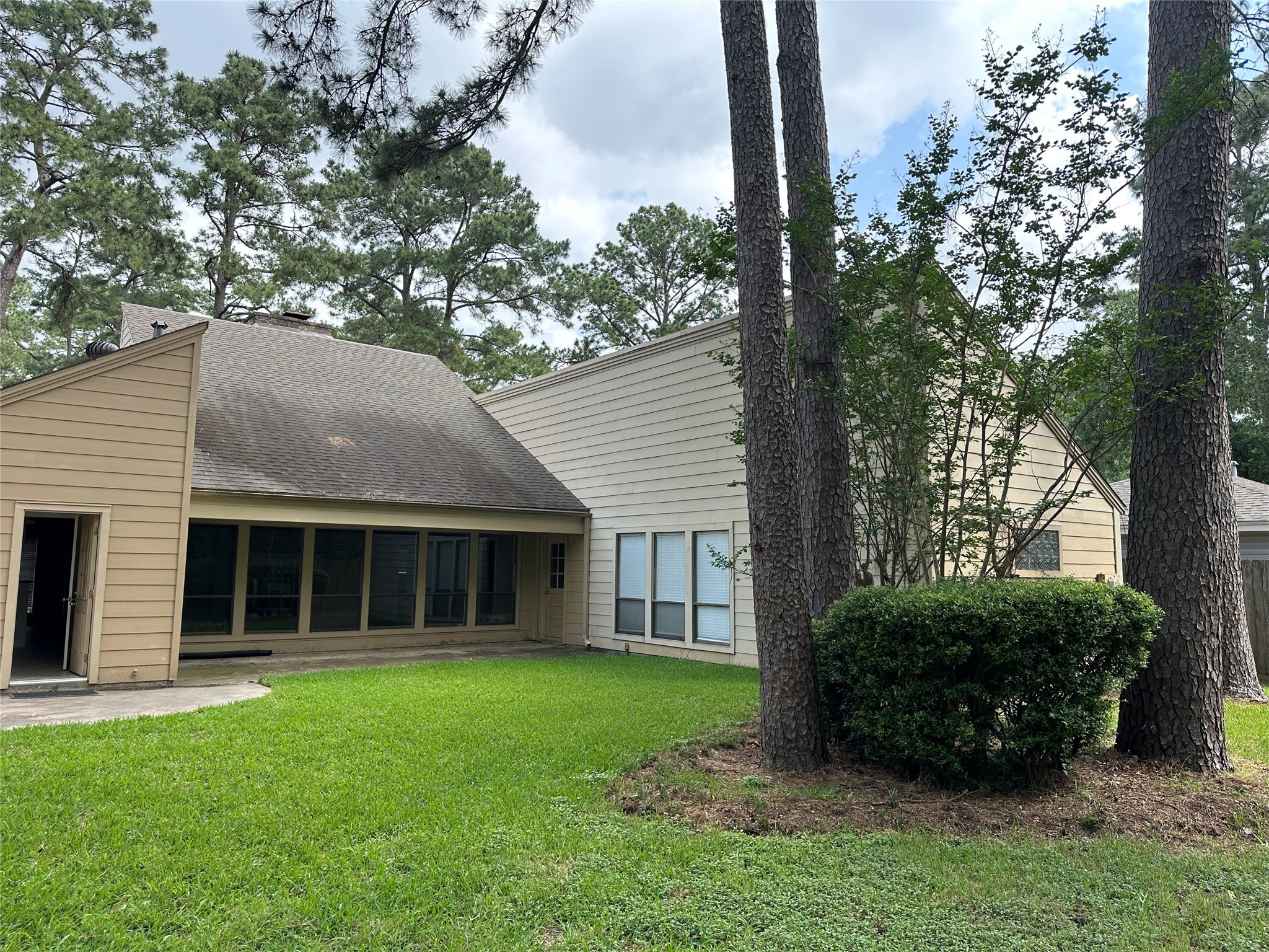 17406 Spicewood Springs Lane Spring, TX 77379 - Photo 37 of 50 a view of an house with backyard space and garden