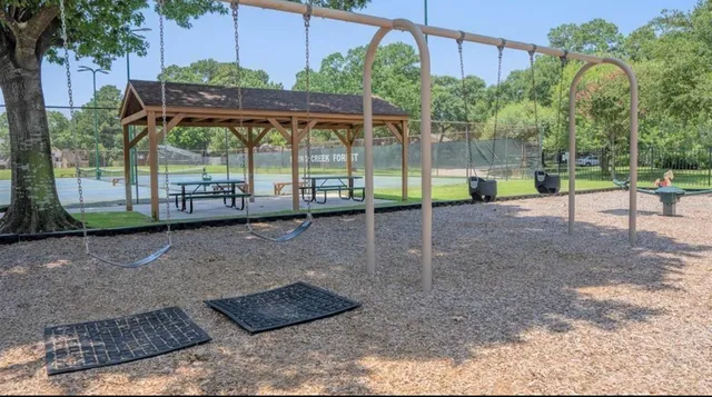 a view of a water fountain in front of the house