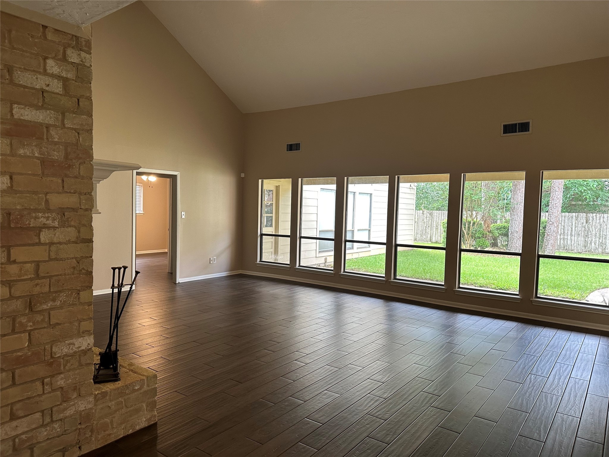 17406 Spicewood Springs Lane Spring, TX 77379 - Photo 9 of 50 a view of empty room with wooden floor and fan