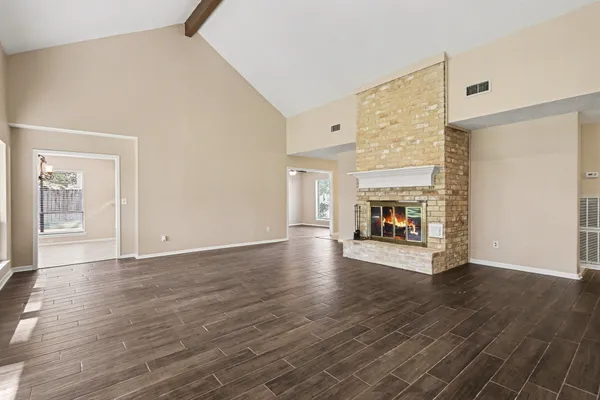 a kitchen with granite countertop a stove sink and cabinets