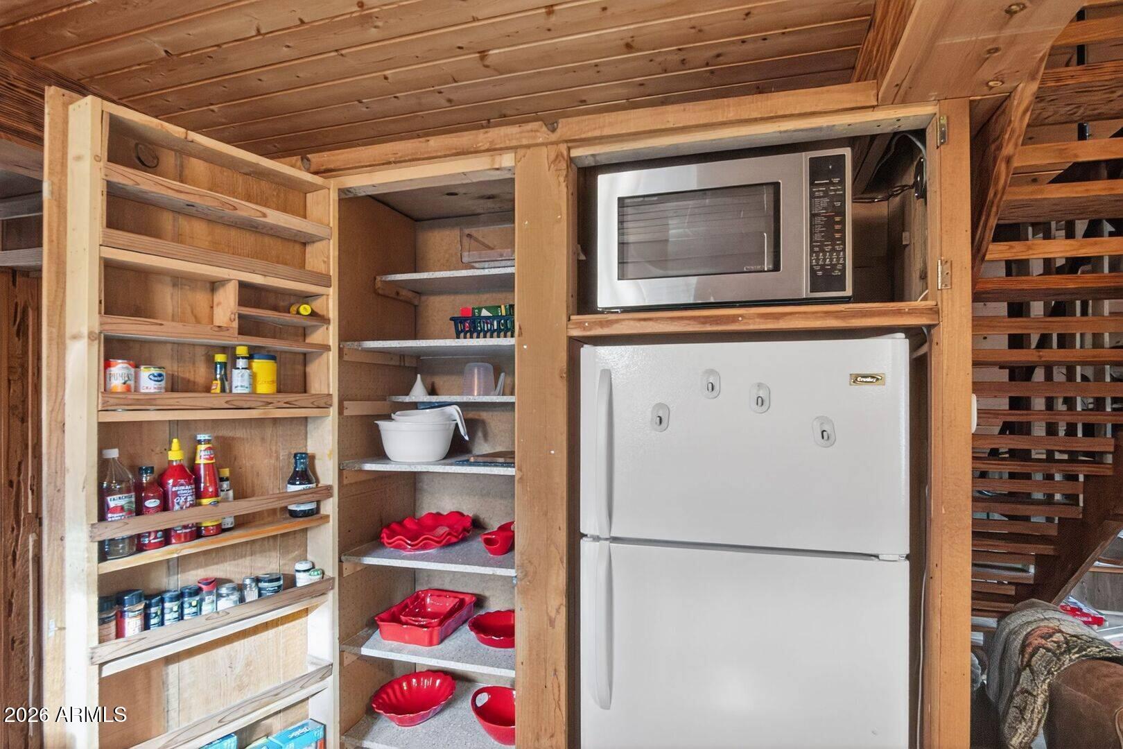 8884 Tonto Rim Drive Pine, AZ 85544 - Photo 22 of 43 a utility room with fridge dryer and washer