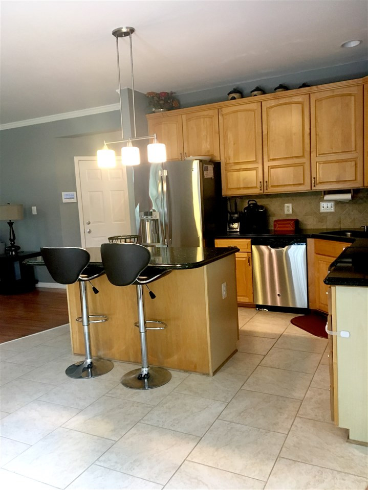 5120 Long Neck Court Raleigh, NC 27604 - Photo 9 of 20 Updated kitchen with tile floor, granite and stainless steel appliances. Kitchen