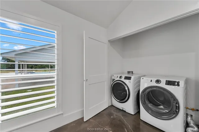a utility room with dryer and washer