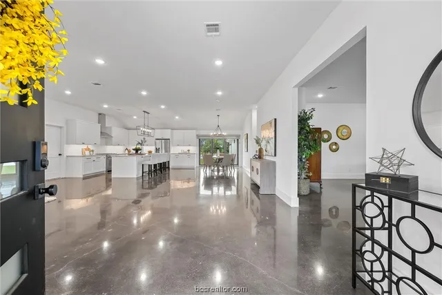 a view of a living room and chandelier