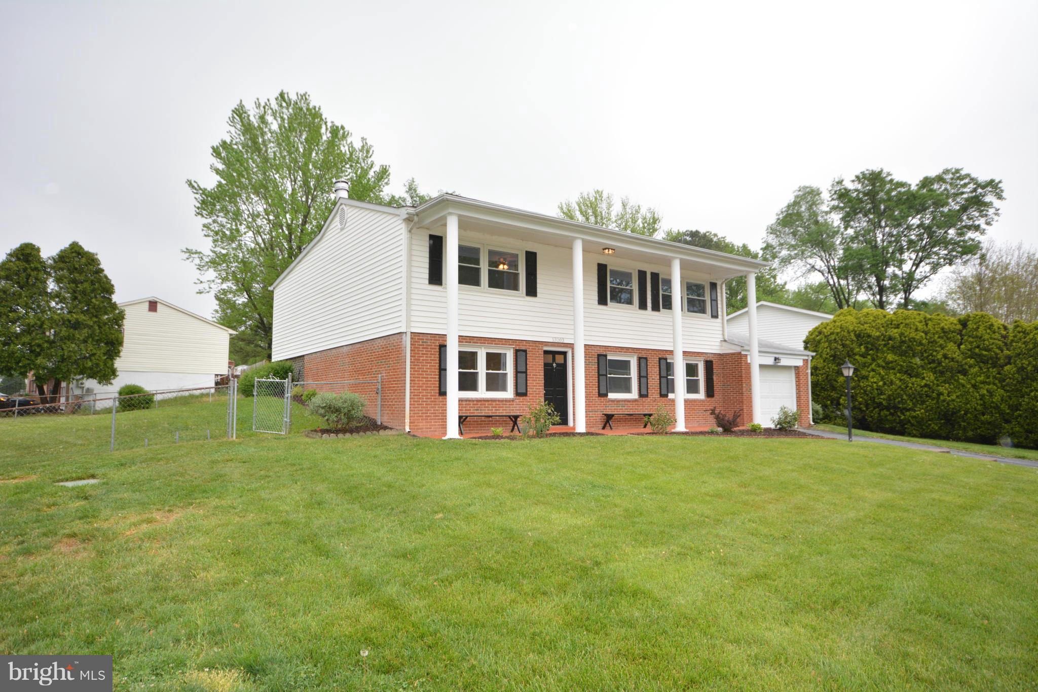 13203 Delaney Road Woodbridge, VA 22193 - Photo 1 of 30 a view of a house with a yard