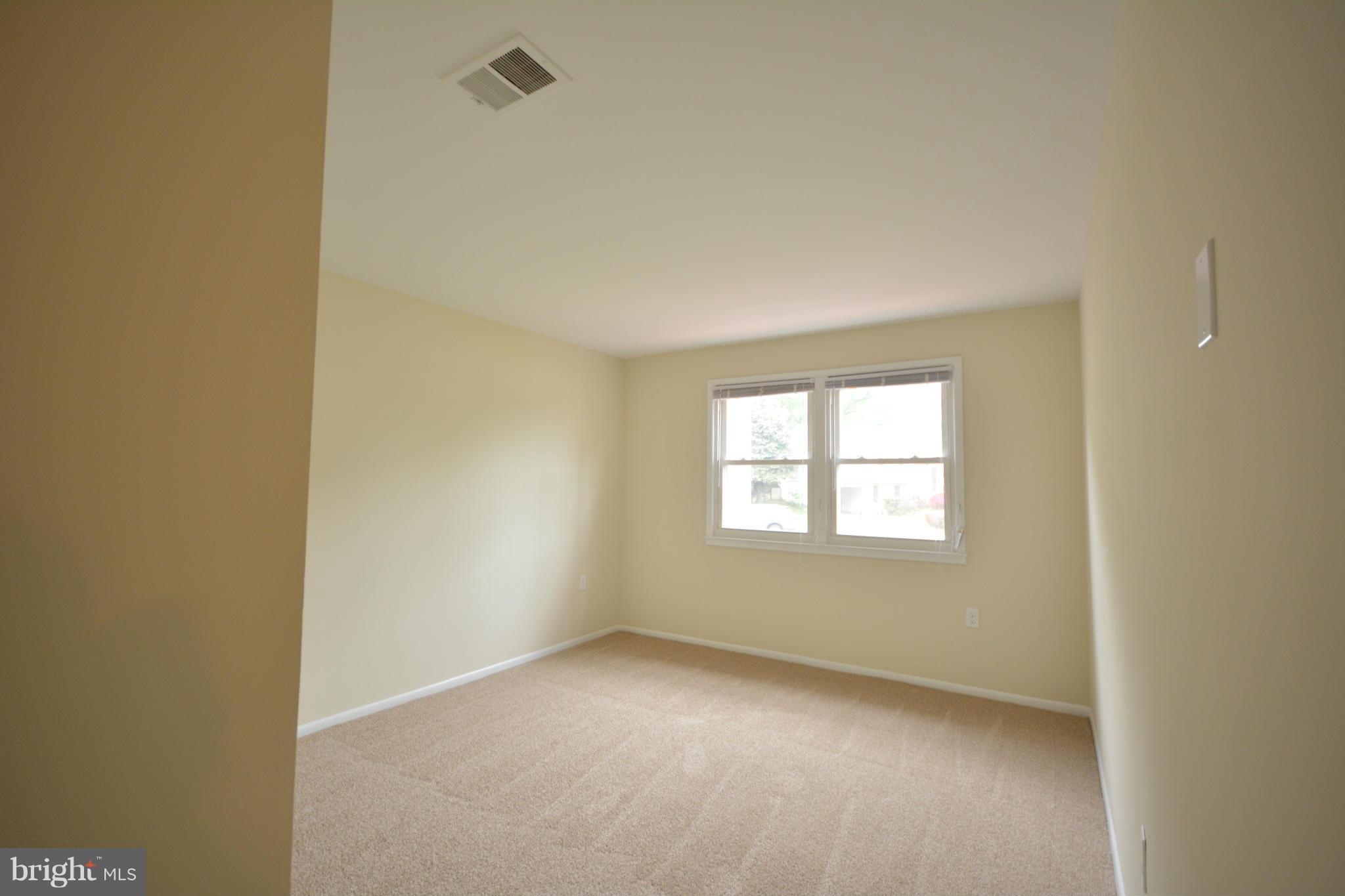 13203 Delaney Road Woodbridge, VA 22193 - Photo 11 of 30 a view of an empty room with a window
