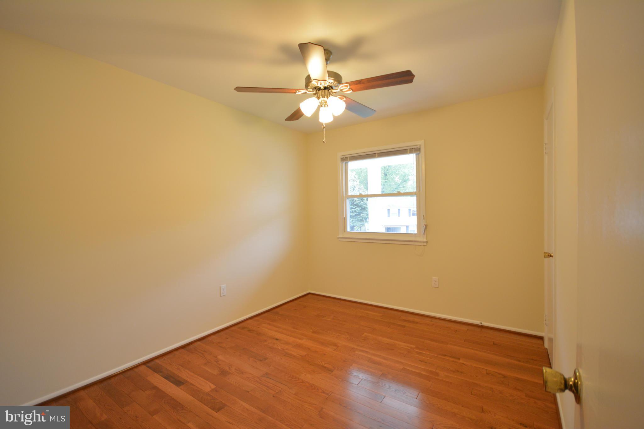 13203 Delaney Road Woodbridge, VA 22193 - Photo 24 of 30 an empty room with a window and a fan
