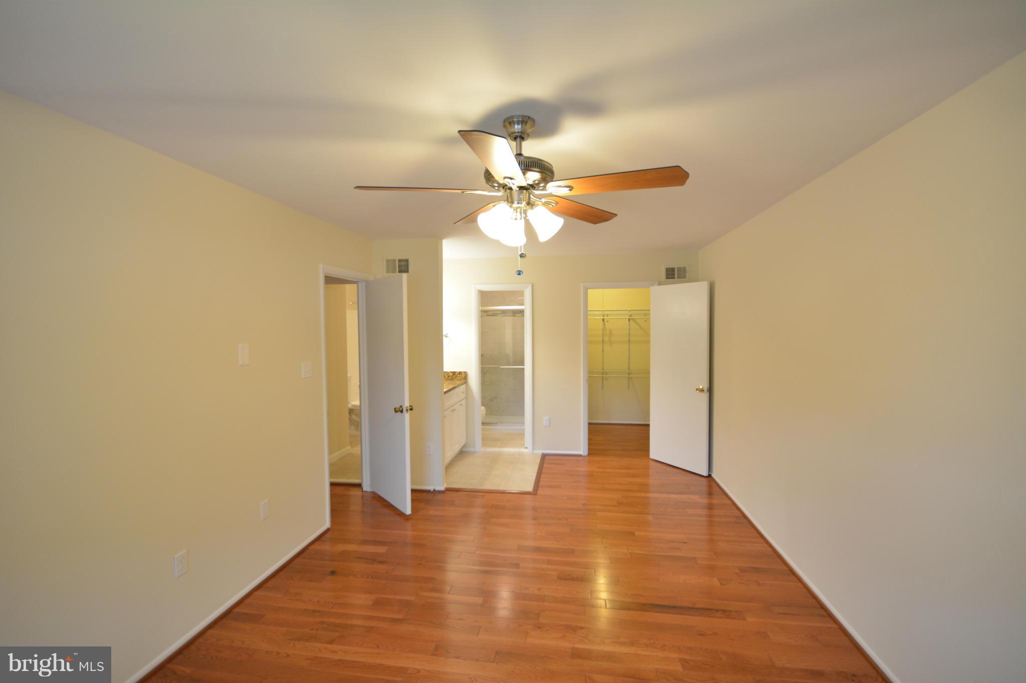 13203 Delaney Road Woodbridge, VA 22193 - Photo 26 of 30 a view of an empty room with wooden floor
