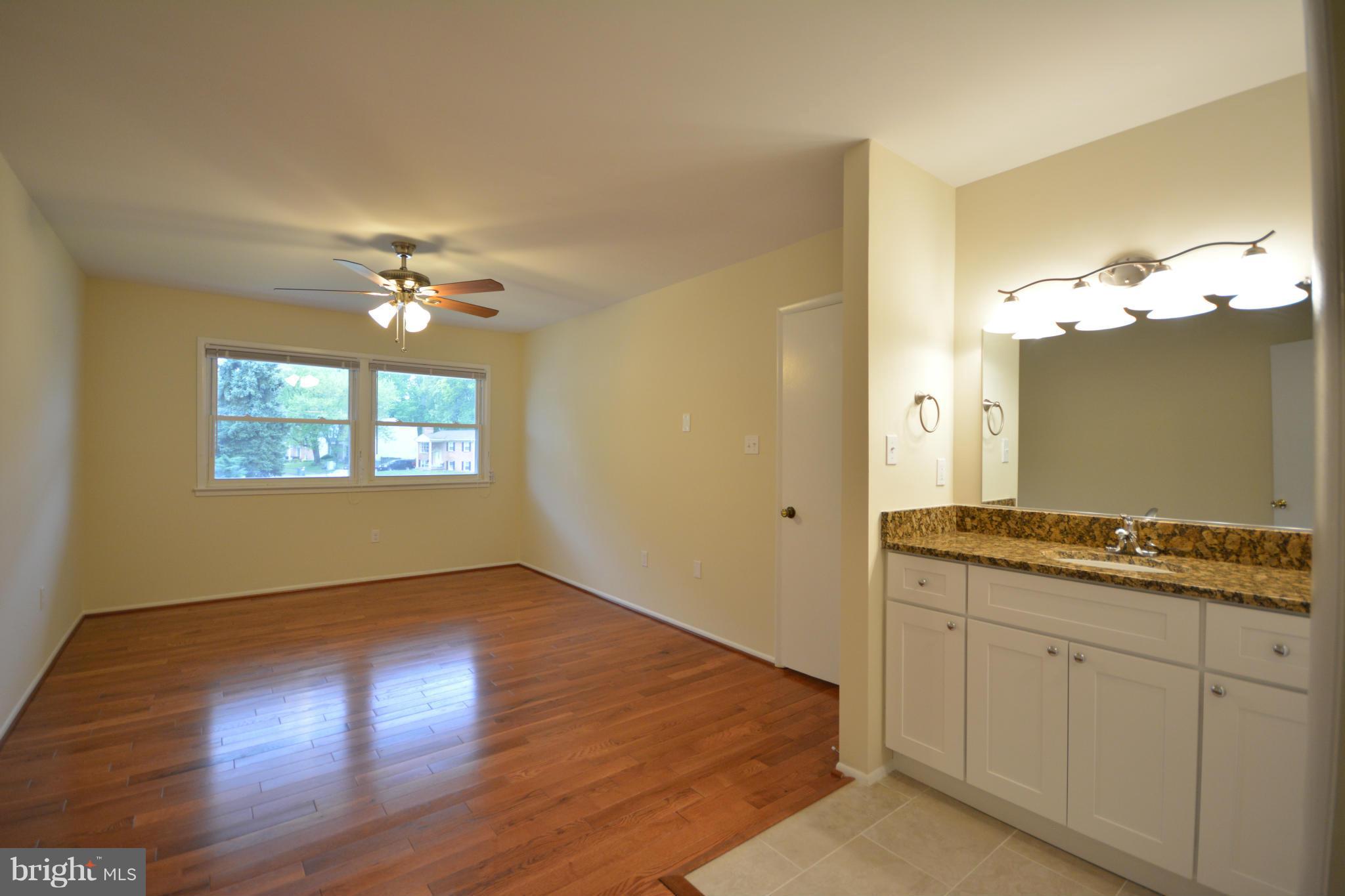 13203 Delaney Road Woodbridge, VA 22193 - Photo 27 of 30 a view of a kitchen from the hallway