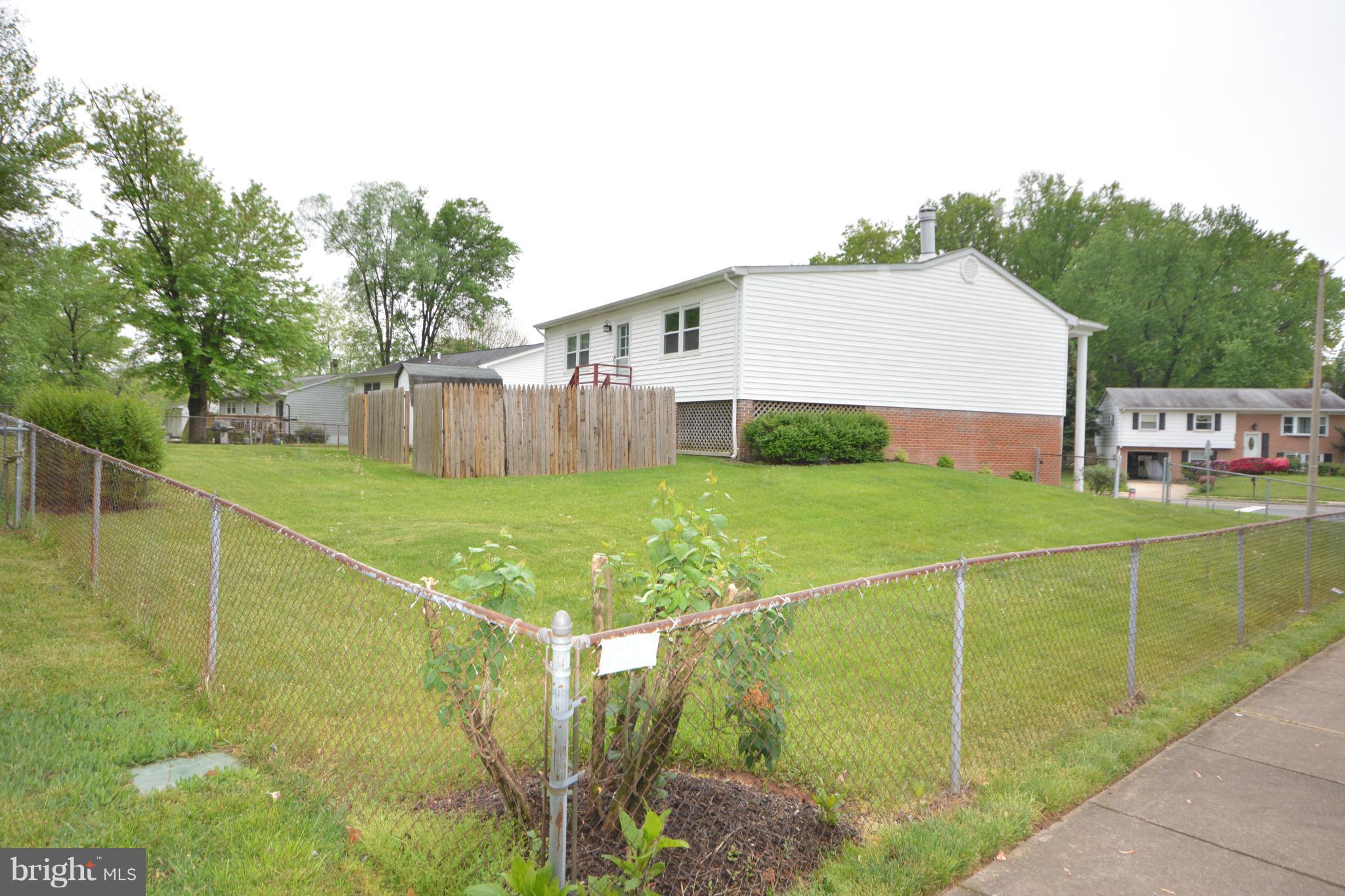 13203 Delaney Road Woodbridge, VA 22193 - Photo 29 of 30 a view of a house with pool