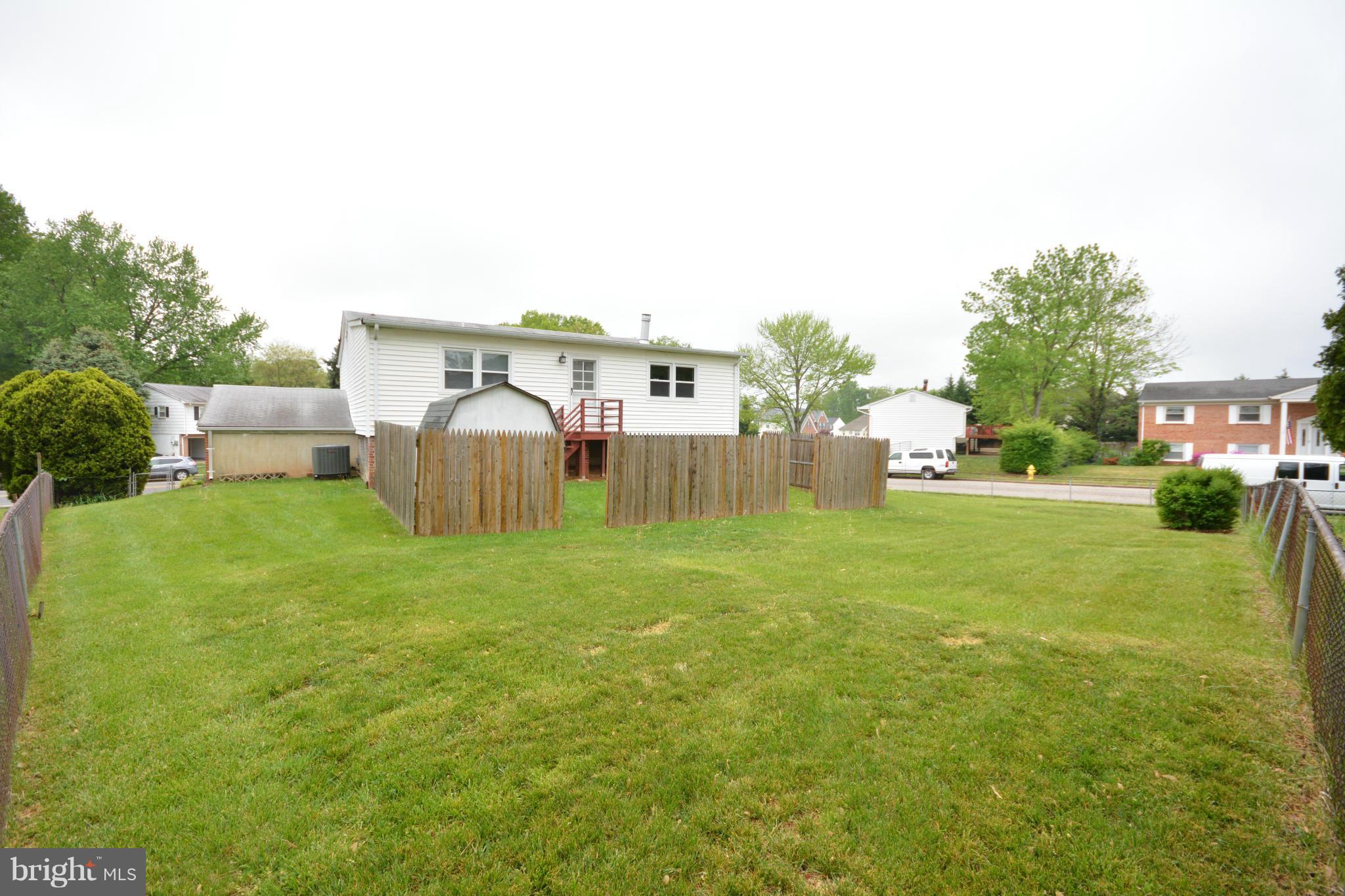 13203 Delaney Road Woodbridge, VA 22193 - Photo 30 of 30 a backyard of a house with table and chairs