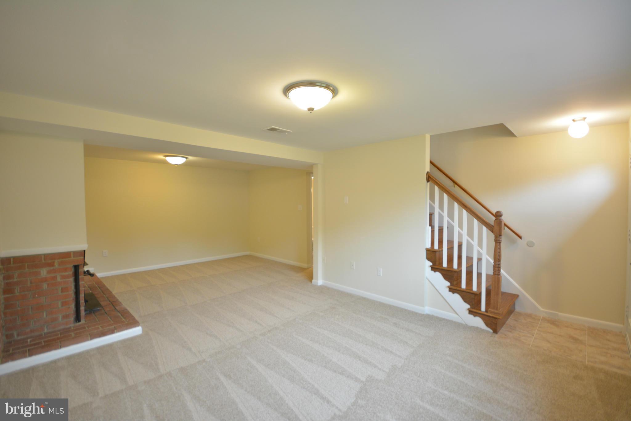 13203 Delaney Road Woodbridge, VA 22193 - Photo 4 of 30 a view of an empty room with stairs