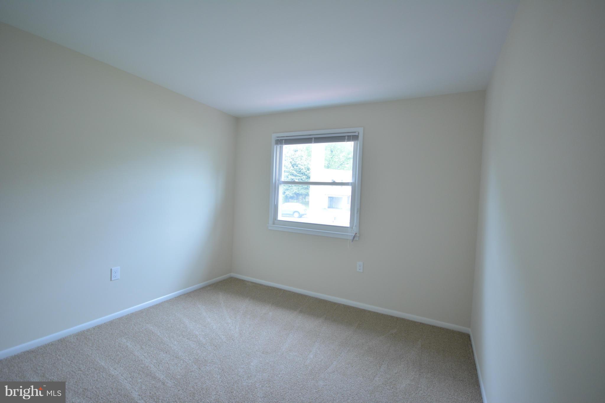 13203 Delaney Road Woodbridge, VA 22193 - Photo 6 of 30 an empty room with a window