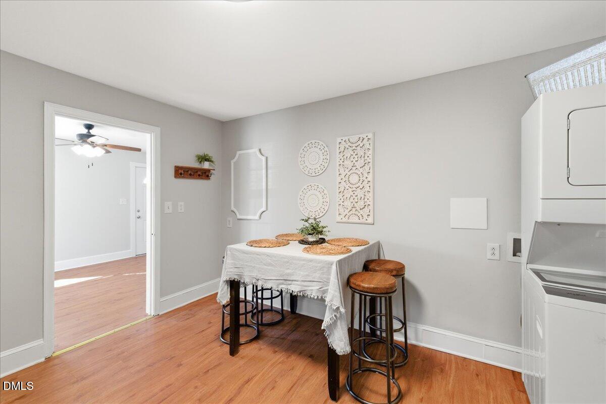 809 Dupree Street Durham, NC 27701 - Photo 12 of 24 a view of a dining room with furniture and wooden floor
