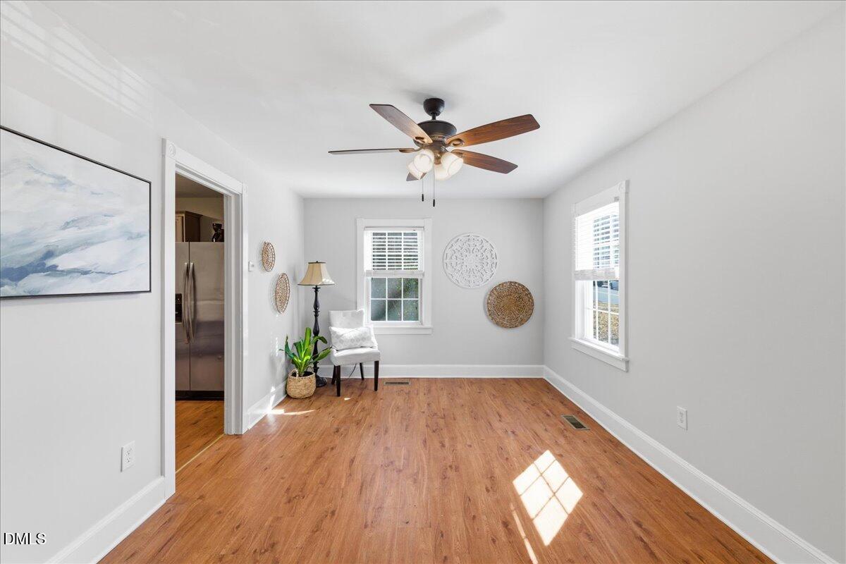 809 Dupree Street Durham, NC 27701 - Photo 9 of 24 wooden floor in an empty room with a window