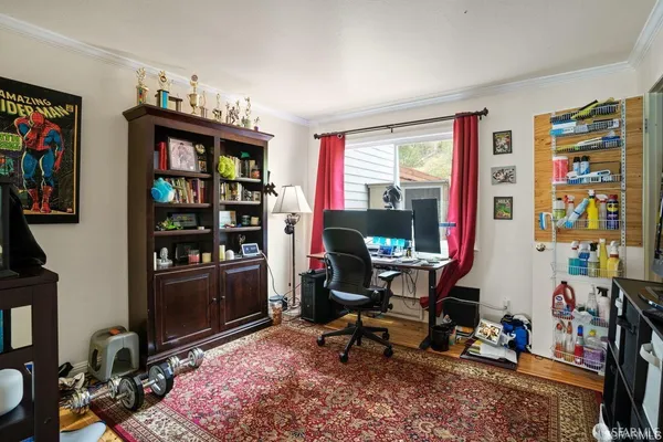 a view of a workspace with furniture and toys