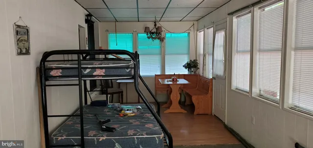 a view of a backyard with couches and swimming pool