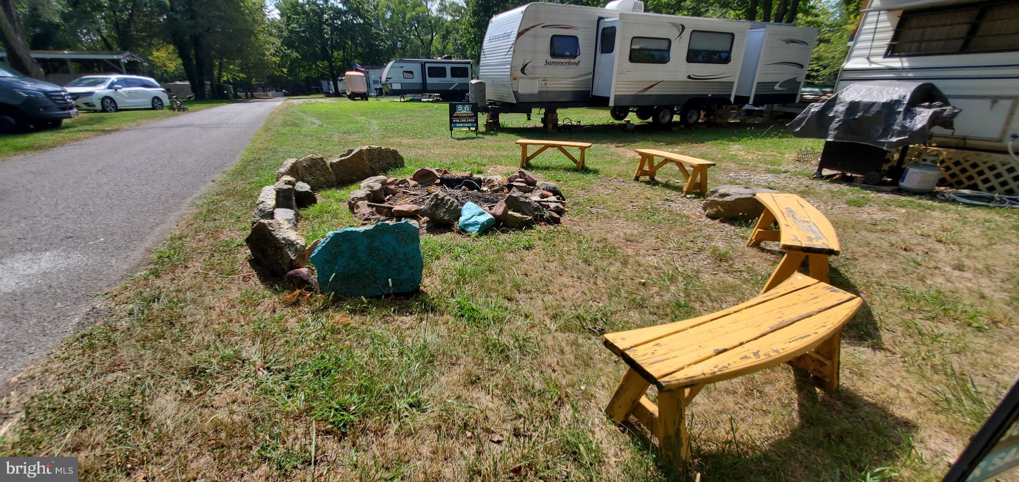 33 Comanche Drive, Unit GLEN 1 Earleville, MD 21919 - Photo 7 of 8 a view of a backyard with couches and swimming pool