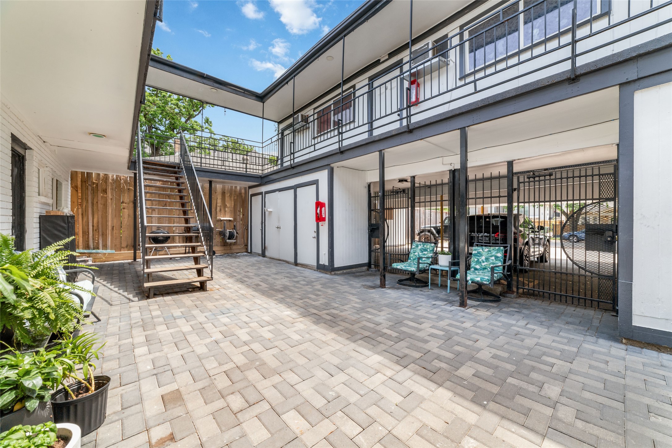 1424 Marshall Street, Unit 9 Houston, TX 77006 - Photo 1 of 17 a view of a porch with furniture and floor to ceiling window