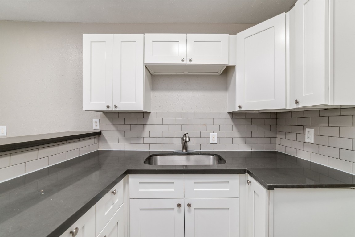 1424 Marshall Street, Unit 9 Houston, TX 77006 - Photo 11 of 17 a kitchen with a sink and cabinets