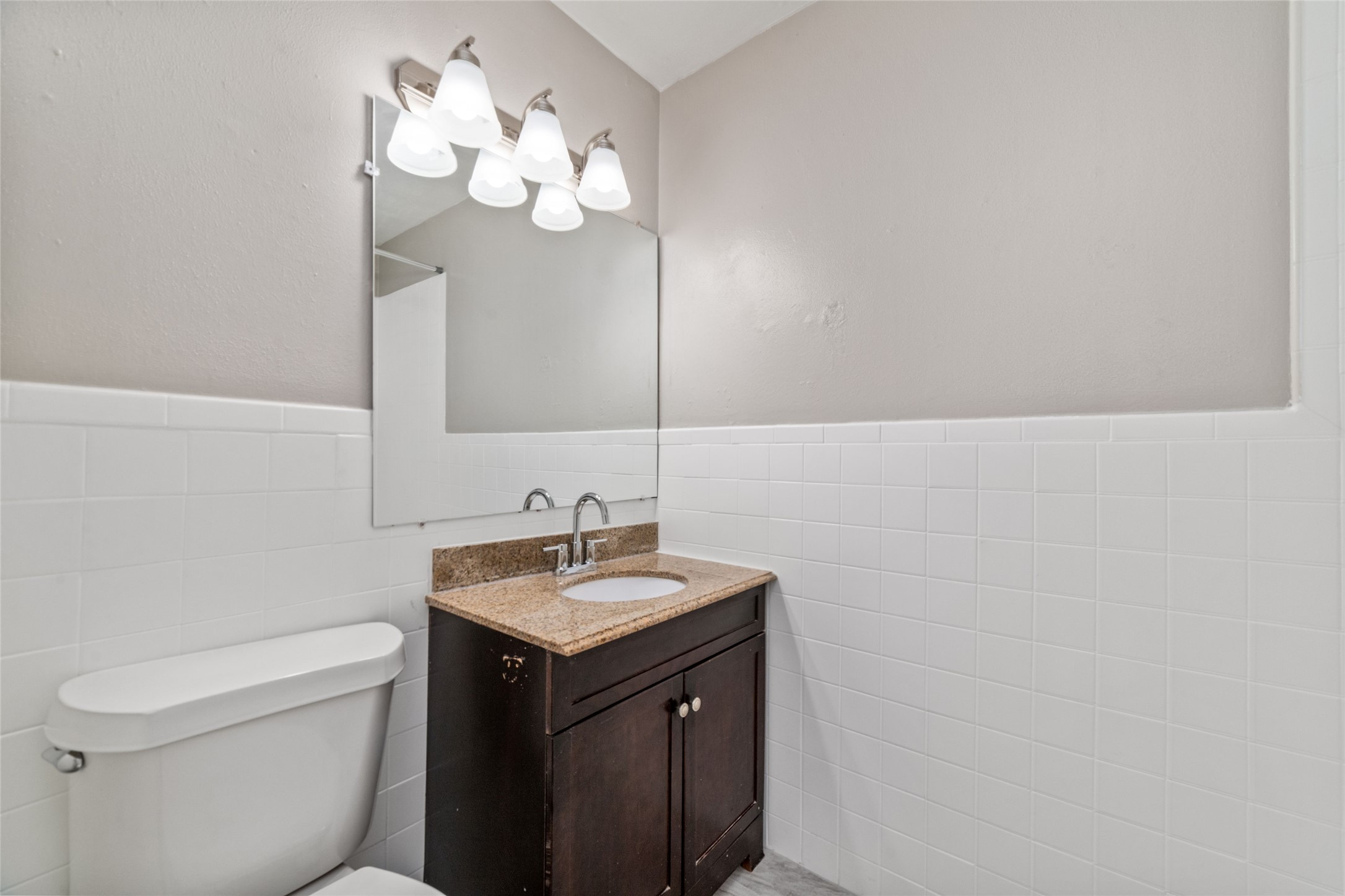 1424 Marshall Street, Unit 9 Houston, TX 77006 - Photo 12 of 17 a bathroom with a sink and a toilet
