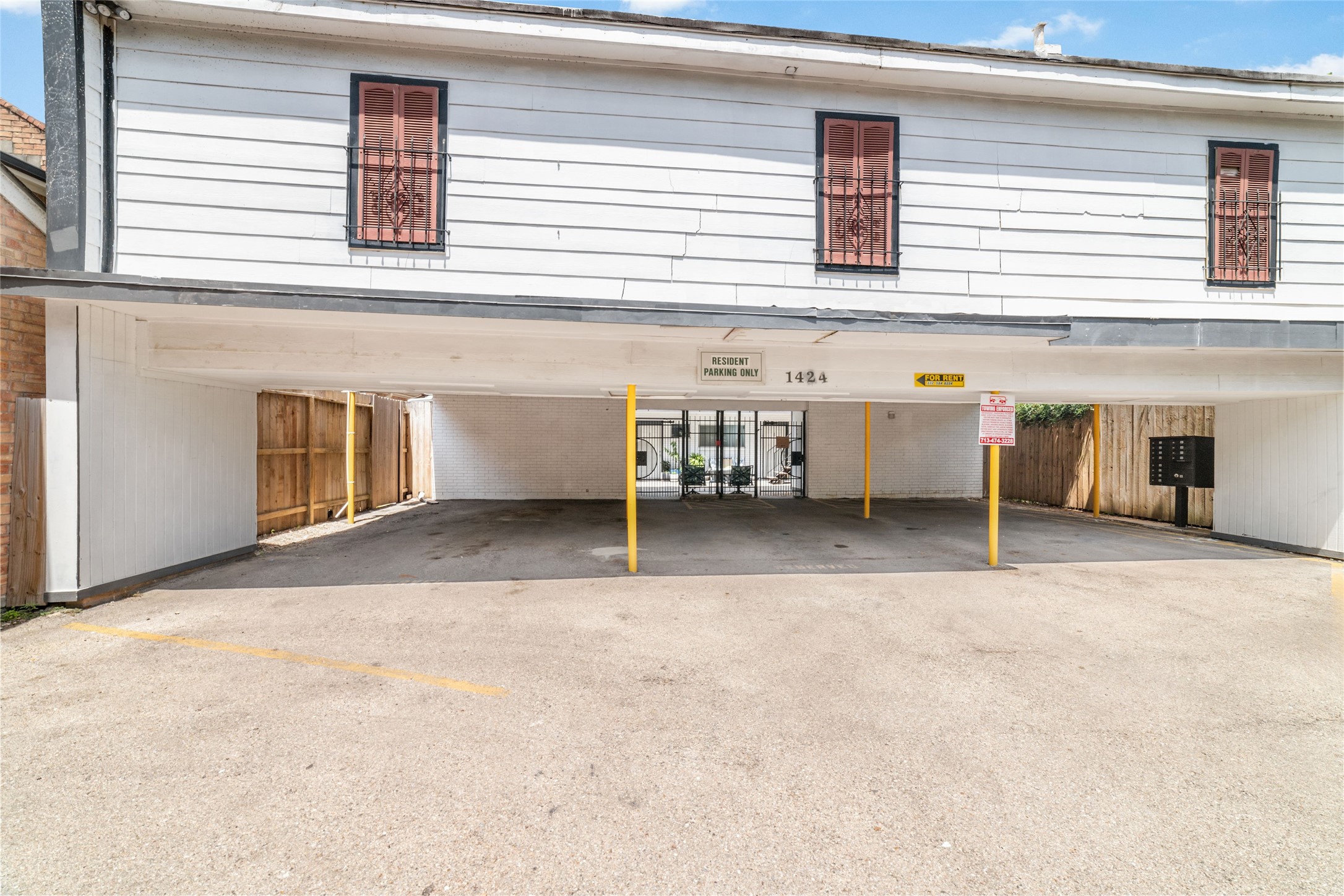 1424 Marshall Street, Unit 9 Houston, TX 77006 - Photo 15 of 17 a view of a house with a parking space and a window