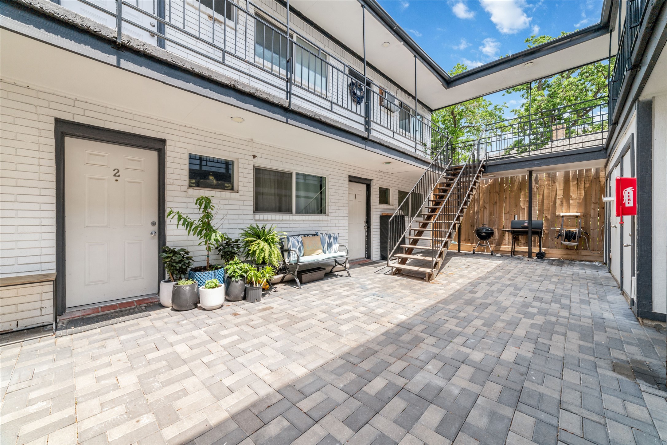 1424 Marshall Street, Unit 9 Houston, TX 77006 - Photo 2 of 17 a view of a backyard with a patio