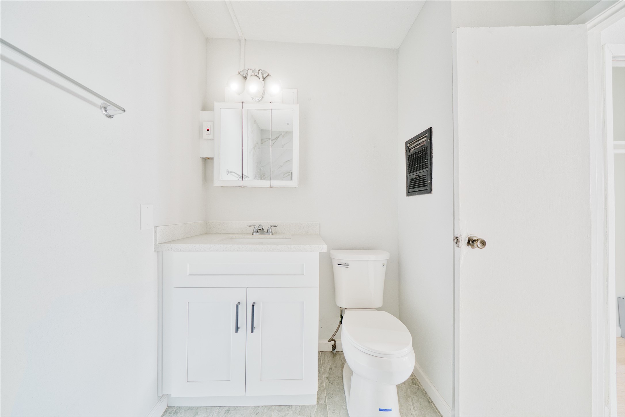 1424 Marshall Street, Unit 9 Houston, TX 77006 - Photo 7 of 17 a bathroom with a sink a toilet and shower
