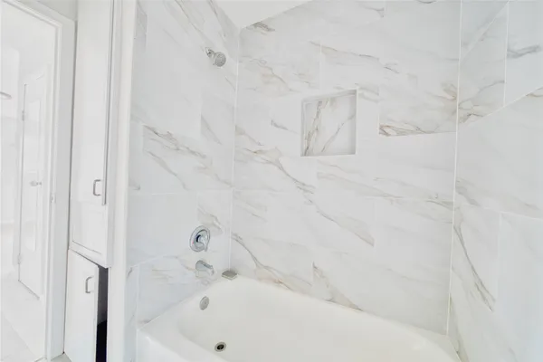 a bathroom with bathtub