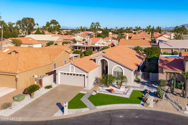a view of multiple houses with a street