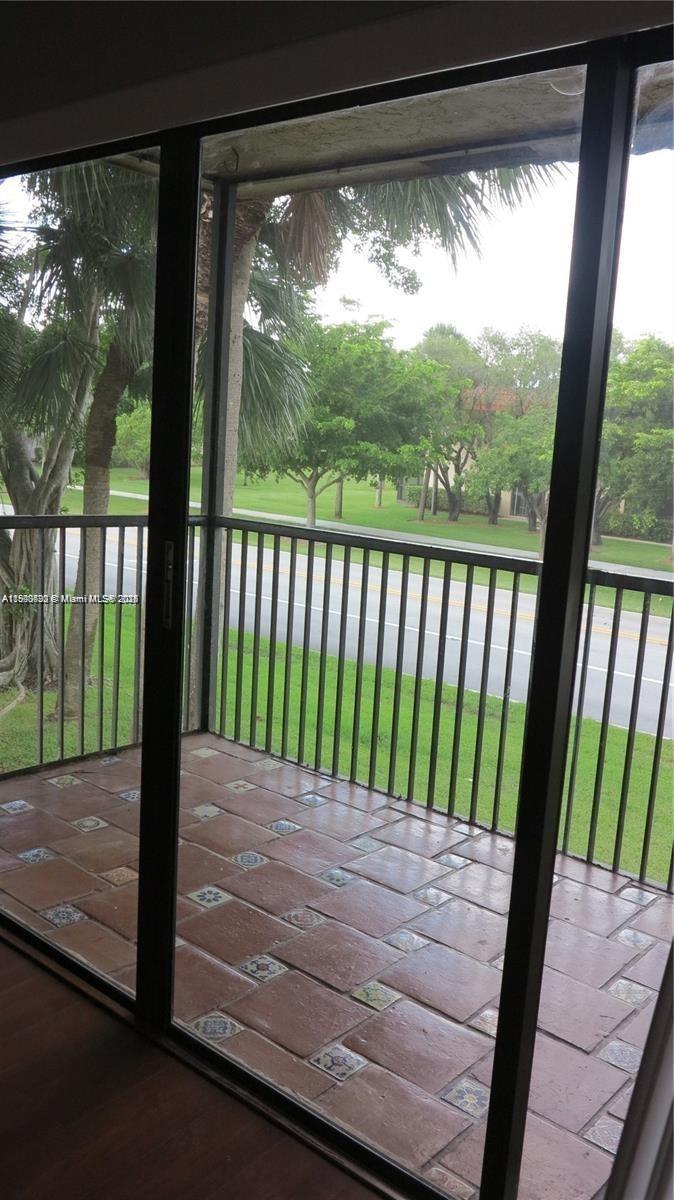 350 Lakeview Drive, Unit 201 Weston, FL 33326 - Photo 11 of 14 a view of a wooden deck