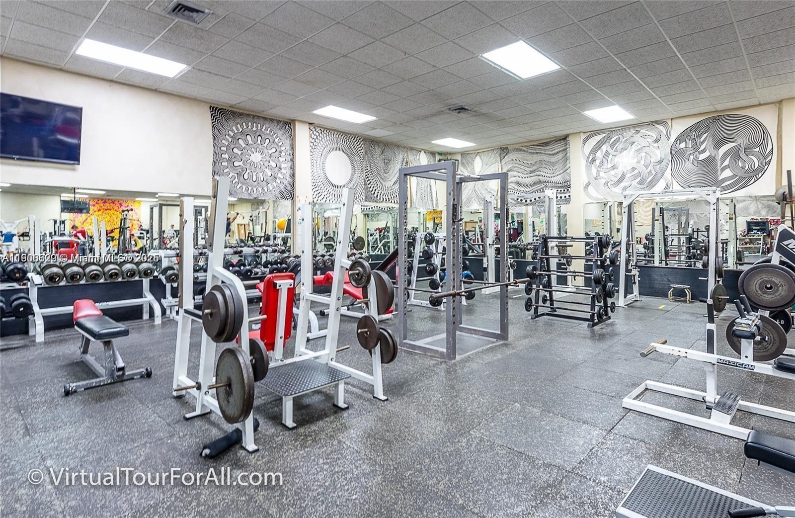 350 Lakeview Drive, Unit 201 Weston, FL 33326 - Photo 14 of 14 a view of a room with gym equipment
