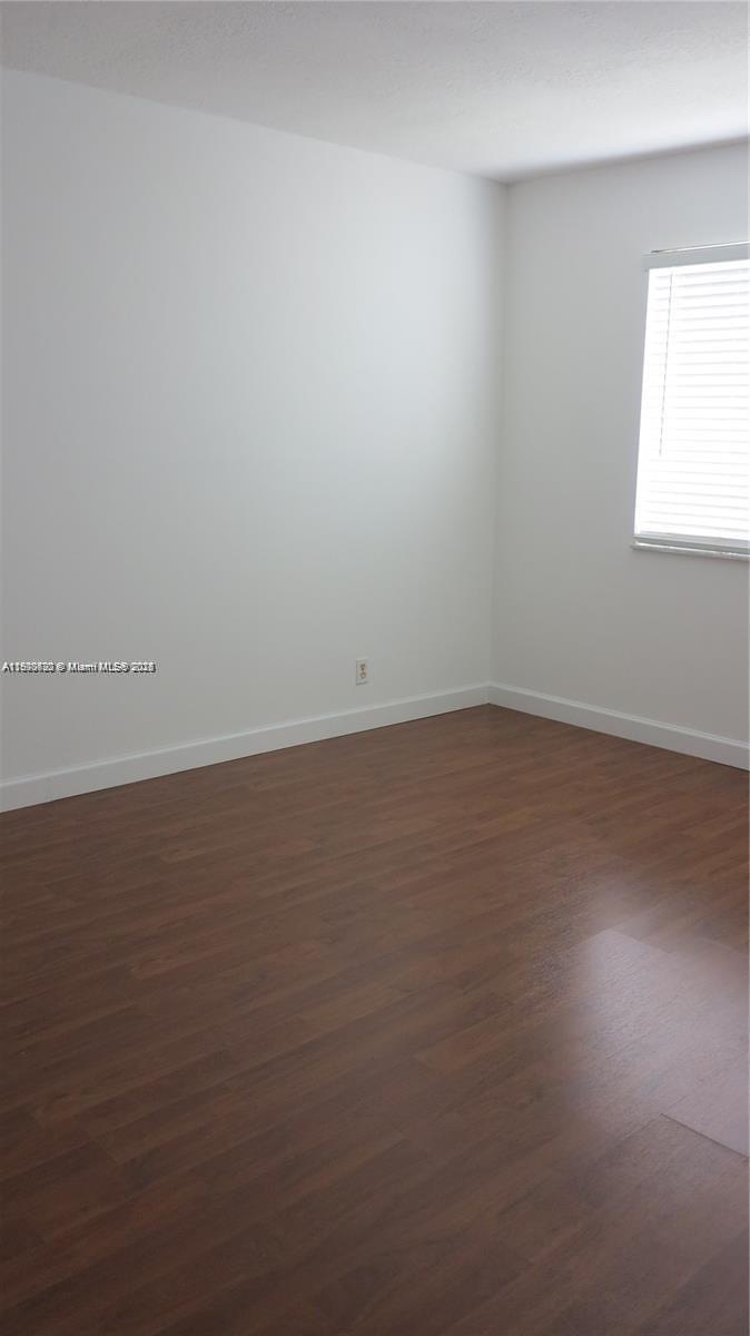 350 Lakeview Drive, Unit 201 Weston, FL 33326 - Photo 7 of 14 an empty room with a window