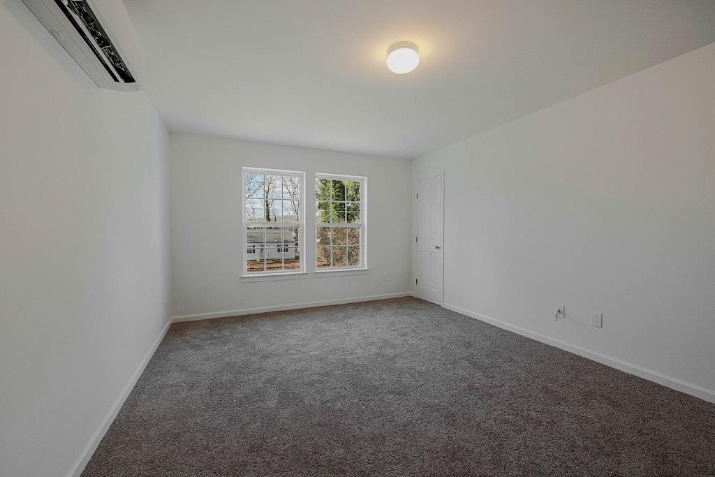 New Construction Neighborhood Road Mastic Beach, NY 11951 - Photo 17 of 28 an empty room with windows