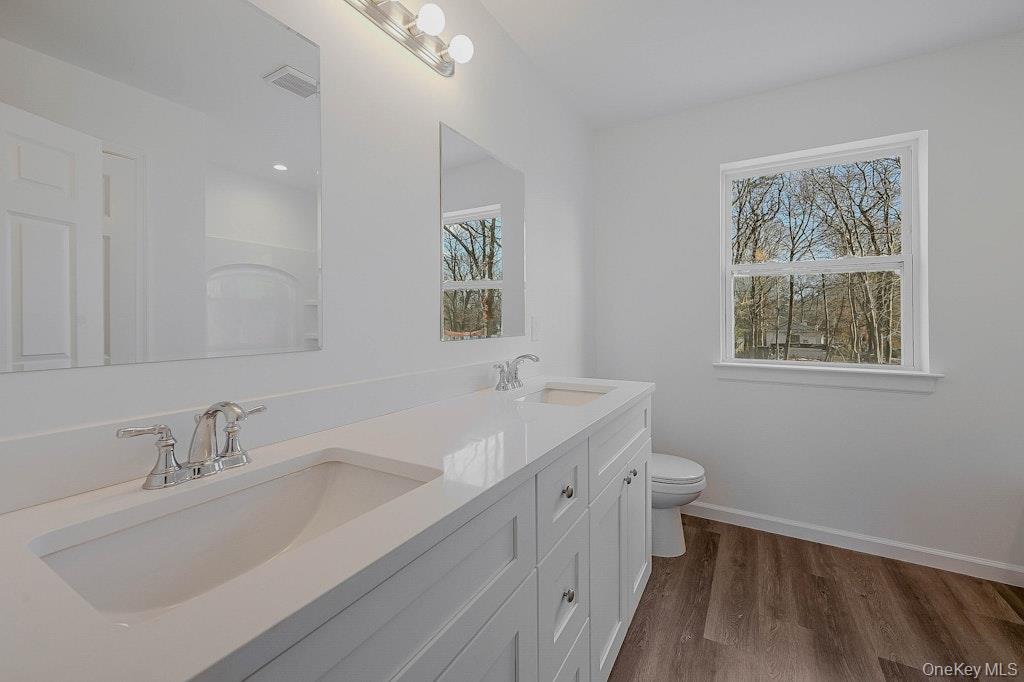 New Construction Neighborhood Road Mastic Beach, NY 11951 - Photo 18 of 28 a bathroom with 2 sink tub and a mirror
