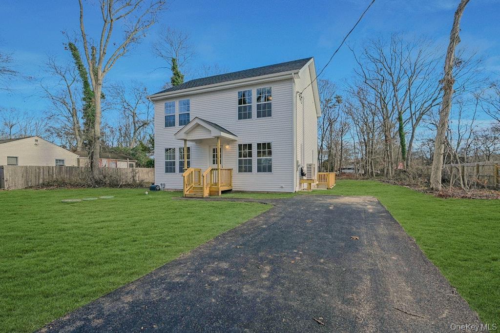 New Construction Neighborhood Road Mastic Beach, NY 11951 - Photo 2 of 28 a view of a house with backyard and a tree